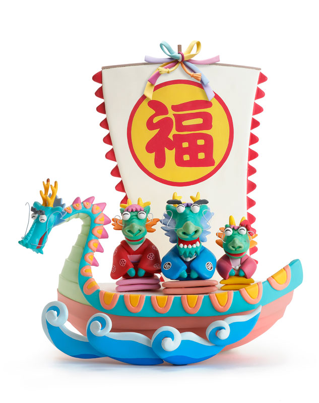 かわいい龍の家族と招福の宝船のイラスト