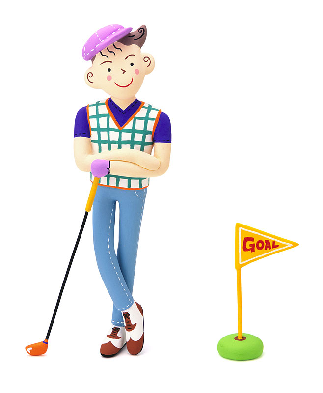 ゴルフ倶楽部を持って笑顔で立つ若い男性